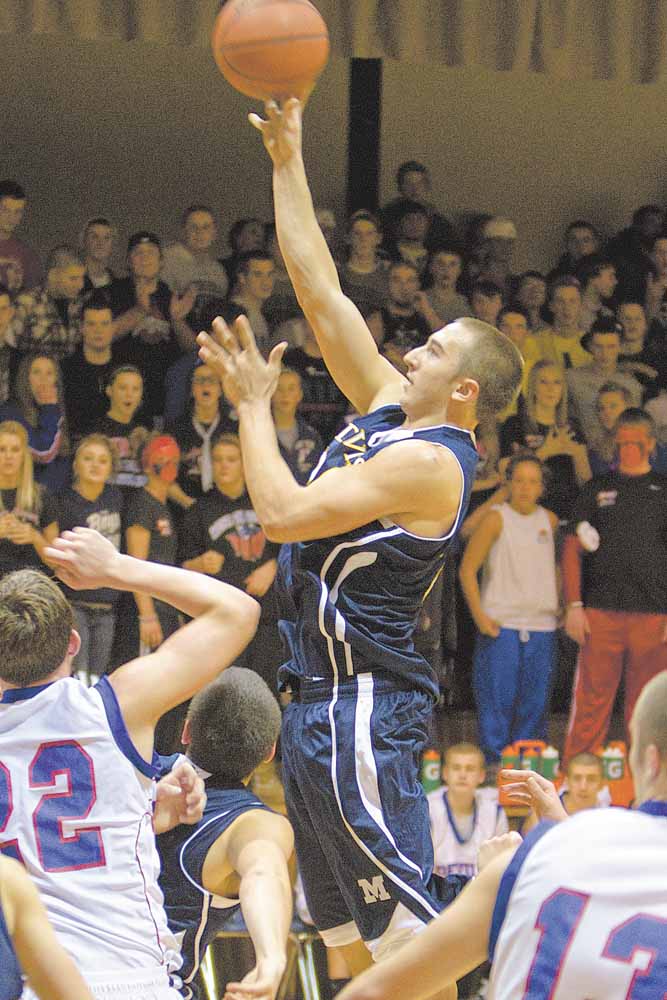 McDonald's Matthias Tayala (24) drives to the net during a game at Western Reserve High School on Friday evening.