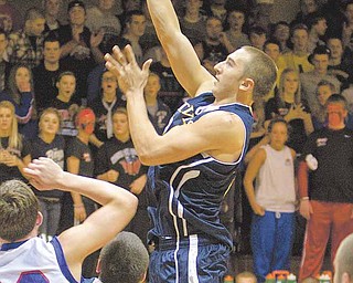 McDonald's Matthias Tayala (24) drives to the net during a game at Western Reserve High School on Friday evening.