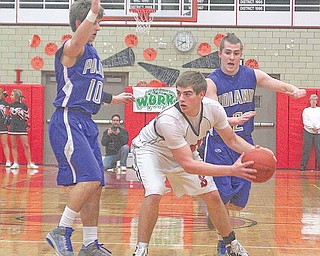 Struthers' Adam Ryczaj (40) looks for help as Colin Reardon (10) and Anthony Machi (2) play defense during their game Wednesday night.
