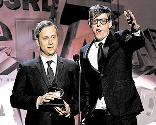 The Black Keys, Patrick Carney, right, and Dan Auerbach accept the award for best alternative music album during the pre-telecast at the 53rd annual Grammy Awards on Sunday, Feb. 13, 2011, in Los Angeles.