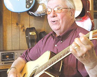 Longtime Mahoning Valley musician Rocky Chirchiglia in his Austintown muic store.