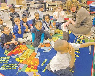 Above, Josiah Young, 5, participates in an exercise matching words and images with their beginning letter in Kim Marzano’s kindergarten class at Taft Elementary School in Youngstown. Teachers at the school use DonorsChoose.org to garner donations to buy teaching materials for their classrooms.