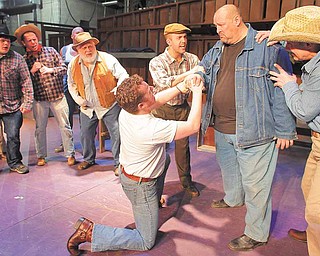 he cast of the Youngstown Playhouse's production of 'Of Mice and Men,' acts out a scene during a recent rehearsal. The production runs February 18th through the 27th.