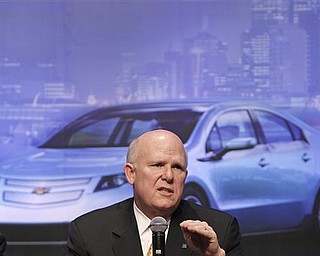 General Motor Co. Chief Executive Daniel Akerson gestures as he speaks during a media conference in Beijing Tuesday, Feb. 15, 2011. China will play a much bigger role in GM's plans as it moves to capitalize further on the world's largest auto market, Akerson said Tuesday. (AP Photo/Andy Wong)