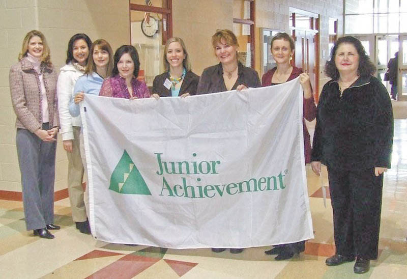 Proving that they support Junior Achievement and its Done-in-a-Day teaching project are, from left, Michele Merkel, Leah Wilson, Marion Dunham, Nicole Laura Rumble, Nicole Widomski, Kim Urig, Anna Sexton Aey, members of the Junior League of Youngstown; and Patty Scalzo, guidance counselor at Taft Elementary School.