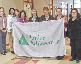 Proving that they support Junior Achievement and its Done-in-a-Day teaching project are, from left, Michele Merkel, Leah Wilson, Marion Dunham, Nicole Laura Rumble, Nicole Widomski, Kim Urig, Anna Sexton Aey, members of the Junior League of Youngstown; and Patty Scalzo, guidance counselor at Taft Elementary School.