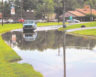 This photo, supplied by the Learning Express Preschool Center on Coit Street Northwest, Warren, shows the flooding problem that occurs just west of the day-care center during warm weather.