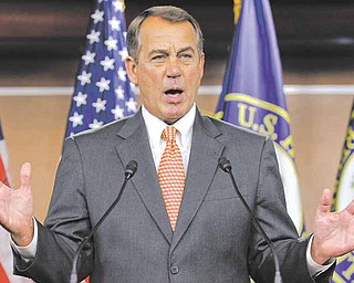 House Speaker John Boehner of Ohio gestures during a news conference on Capitol Hill in Washington on Thursday.
