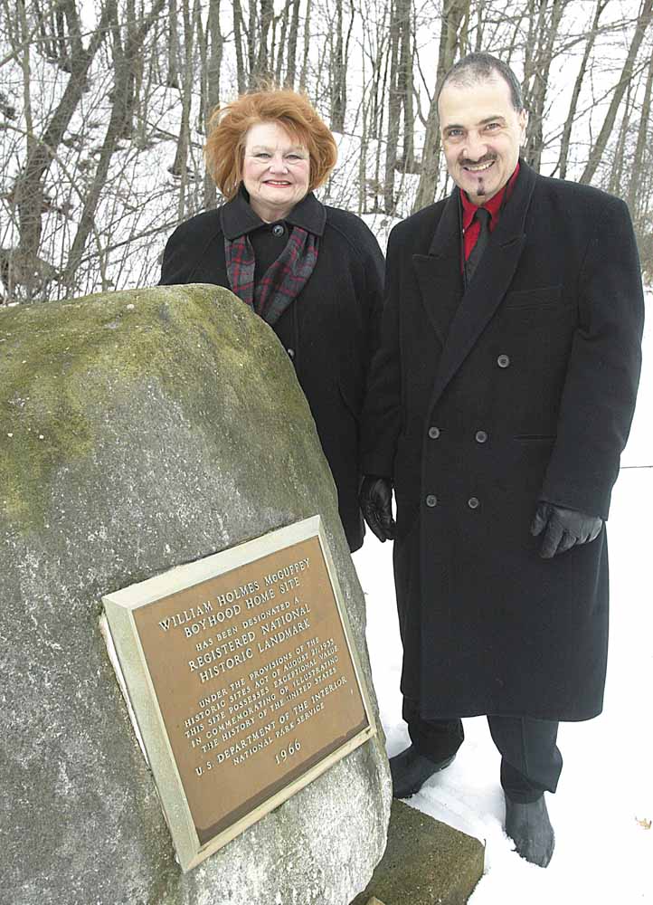 Shirley Eckley, vice-president and secretary of the William Holmes McGuffey Society, and a decedent of William Holmes McGuffey and Richard Scarsella stand hear a plaque at the William Homes McGuffey Wildlife preserve on McGuffey Road.