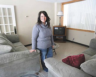 Michelle Beauchene, director of Hannah's House, stands in the Vienna township facility's living area.  