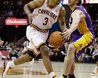 Cleveland Cavaliers' Ramon Sessions (3) drives to the basket against Los Angeles Lakers' Pau Gasol in the second half of an NBA basketball game in Cleveland on Wednesday, Feb. 16, 2011. The Cavaliers won 104-99. 