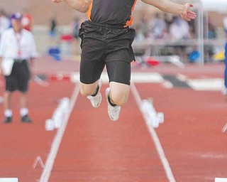 Dan Skiba, of Mineral Ridge, competes in the Division III long jump event at Ohio State University's Jesse Owens Memorial Stadium. Skiba went on to finish in first place in the event.