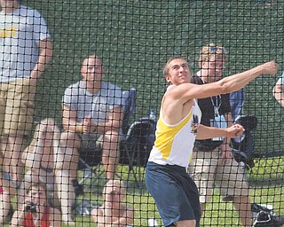 McDonald's Matthias Tayala throws the discus during Division III competition at Ohio State University's Jesse Owens Memorial Stadium. Tayala finished second place in the event.