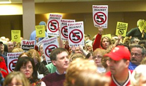 More than 200 people were turned away from the Chestnut Room in Youngstown State University’s Kilcawley Center, which was packed with a standing-room-only crowd when the rally against Senate Bill 5 began. Firefighters, teachers and police were among crowd, which came out Monday to protest the bill that would eliminate collective bargaining for state employees.