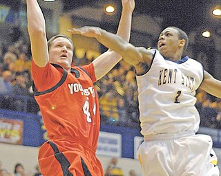 KSU's Eric Gaines tries to block a shot by YSU's Vytas Sulskis during the first period on Tuesday night at the Kent State MAC center in Kent, Ohio.