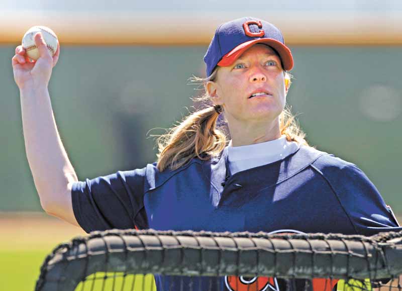 Justine Siegal throws batting practice to Cleveland Indians catchers during baseball spring training, Monday, Feb. 21, 2011, in Goodyear, Ariz. Siegal became the first woman to pitch batting practice at a Major League camp.