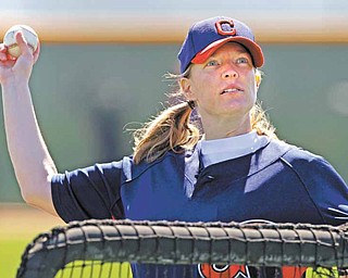 Justine Siegal throws batting practice to Cleveland Indians catchers during baseball spring training, Monday, Feb. 21, 2011, in Goodyear, Ariz. Siegal became the first woman to pitch batting practice at a Major League camp.