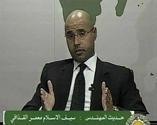In this video image broadcast on Libyan state television early Monday Feb. 21, 2011 Seif al-Islam, son of longtime Libyan leader Moammar Gadhafi, speaks. Al-Islam says protesters have seized control of some military bases and tanks, and also warned of civil war in the country that would burn its oil wealth.