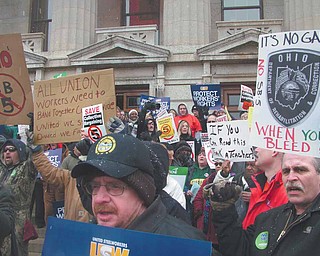 Groups of protesters gathered Tuesday outside the statehouse in Columbus to voice their opposition for Senate Bill 5, which would eliminate collective bargaining for state workers in Ohio, Only about 1,500 people were allowed inside the building, which left more than 3,000 people standing out in the cold.