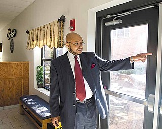 The Rev. Kenneth Simon, pastor of New Bethel Church, discusses security measures at the church at 1507 Hillman St., Youngstown. The size of the church called for a security system to be in place to monitor building access. Doors are locked when no service or event is taking place.