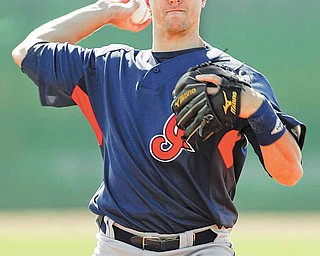 Cleveland Indians' Lonnie Chisenhall throws during baseball spring training practice Friday, Feb. 26, 2010, in Goodyear, Ariz.