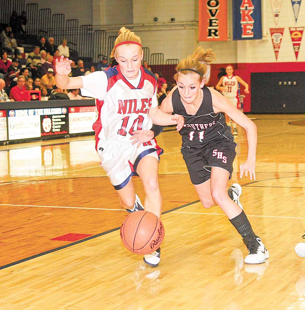 Struthers' Katelyn Ardale battles Samii Ramer (10) for the ball during their game Wednesday night in Austintown. 