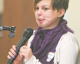 Johanna Orozco, of Cleveland, a victim of teenage violence, spoke to a crowd of local counselors, teachers and teens at the YWCA on North Park Avenue in Warren. Orozco’s ex-boyfriend shot her in the face in 2007.