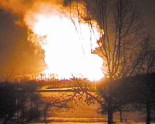 A fire rages after a natural gas explosion in Columbiana County on Feb. 10. No one was injured.