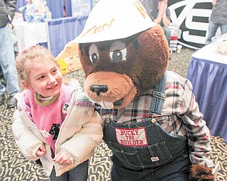 Megan Miller, 5, of Salem gets a hug from Bucky the Builder, the beaver mascot of the Home Builders-Remodelers Association of the Mahoning Valley. Jake Amon of Poland portrayed Bucky at the 60th annual HBA Home and Garden Show, which continues from 10 a.m. to 6 p.m. today at Mr. Anthony’s Banquet Center in Boardman.