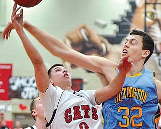 Struthers' Jake Jacubec (3) is fouled by Stephan Jankovic (32) of Huntington Prep.