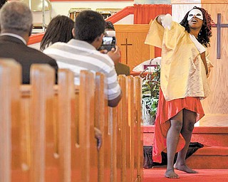Lela Decembly, 26, performs an inspirational dance during a talent show held Sunday afternoon at Beulah Baptist Church in Youngstown.