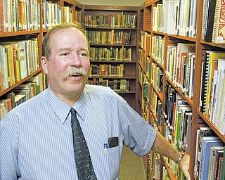 Retiring Fitch High School media teacher Harold Wilson in the school's media center. Wilson is calling quits after 37 years in the Austintown district.