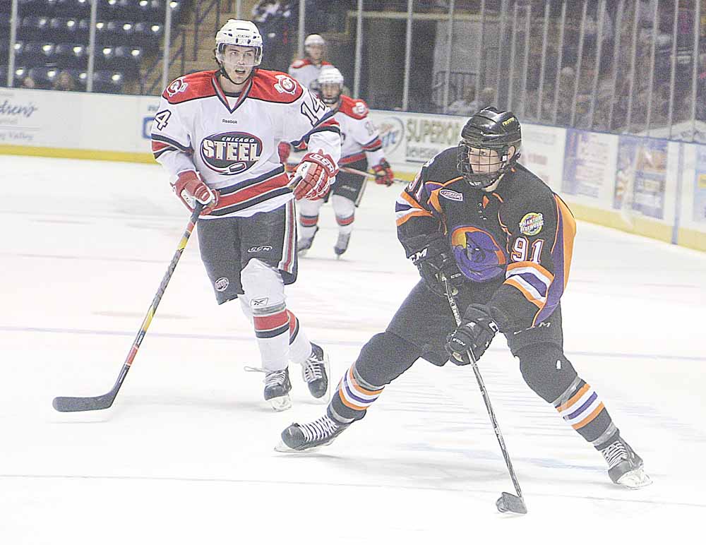 Phantoms Dylan Margonari (91) looks to pass as Tim Weber (14) plays defense during thieir game Sunday afternoon in Youngstown.