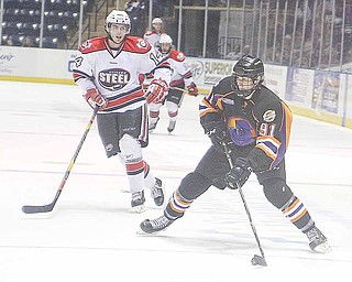 Phantoms Dylan Margonari (91) looks to pass as Tim Weber (14) plays defense during thieir game Sunday afternoon in Youngstown.