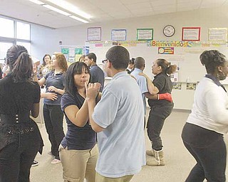 East High School students cut a rug in a classroom in preparation for Friday’s Quinceanera at the school. A Quinceanera celebrates a girl’s maturity into a young lady.