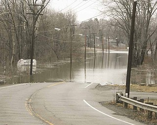 Flooding on state Route 46 and McKees Lane in Weathersfield Township in Trumbull County caused the road to be closed to traffic for several hours Monday.