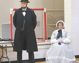 Gerald Payn looks the part of Abraham Lincoln dressed in a long black suit coat and trousers along with the trademark top hat. His wife, Marilyn, plays the part of Lincoln’s spouse, Mary Todd. Payn portrayed the 16th president for students at Girard Intermediate School Monday.