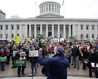 Protestors in opposition of Senate Bill 5 gather at the Ohio Statehouse, Saturday, Feb. 26, 2011, in Columbus, Ohio. The bill would strip public employees of collective bargaining rights. 