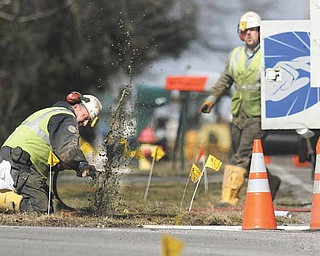 Dominion East Ohio workers and safety officials hustle to locate and shut off gas valves Tuesday afternoon on Hitchcock Road in Boardman.