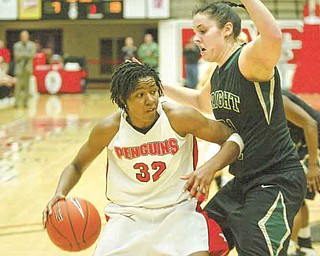 William D. Lewis The Vindicator YSU's #32 Tierra Jones looks to pass around WSU's Molly fox during 1 rst half action 1-20-2011 in Youngstown.