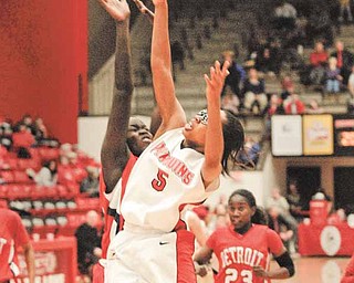 Penguin Kenya Middlebrooks collides with Detroit Titan Yar Shayok during a shot attempt.