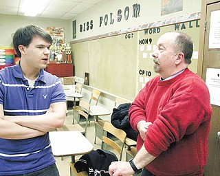 Curry talks with Fitch High School senior Joe Soriana during practice for statewide competition today in Toledo.