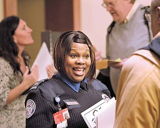 In this March 1, 2011 photo, TSA lead officer Terri Spann recruits workers at a job fair in SeaTac, Wash. The number of people requesting unemployment benefits last week plunged to a nearly three-year low, bolstering hopes that companies will hire more this year.