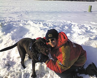 Jacob Turk of Hermitage, Pa., plays with Hershey, a 2-year-old Chocolate Labrador at Linden Point. Hershey loves to catch the snowballs that Jacob throws for her. Hershey is owned by Emilia Clune of Hermitage, who sent in the photo.