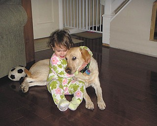 Michalea and Bella Roberts of Bowie, Md., share a sweet moment. They are the granddaughter and "granddog" of Thomas and Joanne Roberts of Canfield.