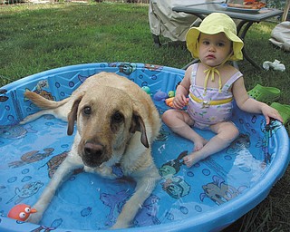 Michalea and Bella Roberts of Bowie, Md., enjoy some summer weather while relaxing in the pool. They are the granddaughter and "granddog" of Thomas and Joanne Roberts of Canfield.