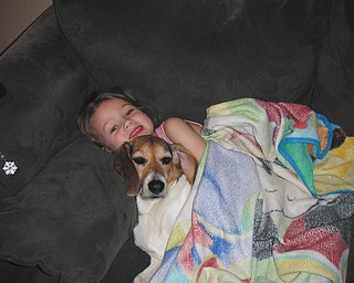 Brelyn Bower of Austintown relaxes with her dog Trinity. They're both 5 1/2 years old. Brelyn is the daughter of Brandon and Jackie Bower, who sent in the photo.