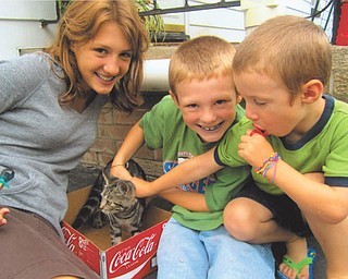 The Antelman siblings, Nihera, 15, Asael, 9, and Yashar, 5, are showering lots of attention on Rascal Flatts. Their sister Natiya, 18, took this picture while their family was visiting their grandmother, Nancy Kausits of Youngstown, last August. Autumn Kausits of Youngstown, their aunt, submitted the photo.