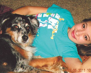 Alexa Marco, 13, relaxes on the floor with her Australian Shepherd, Angus. They live in Boardman. Photo taken and submitted by Alexa's mom, Paula.