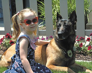 Veronica Cionni hangs out with Robby, a retired Boardman police dog who has been her best friend since she was born. She is the daughter of Brian and Krissie Cionni of Poland.